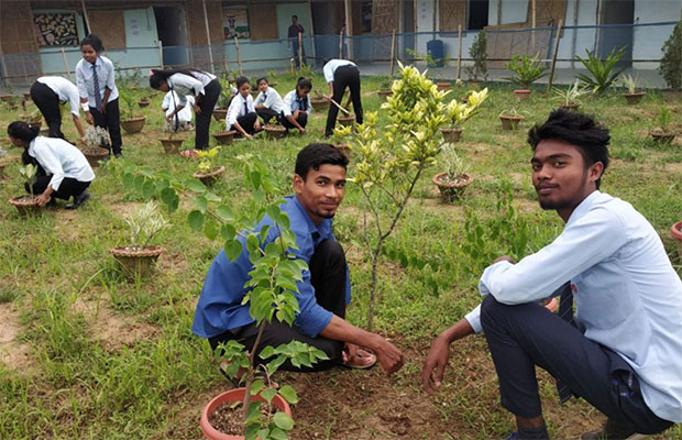 Youth in India working together in their school garden